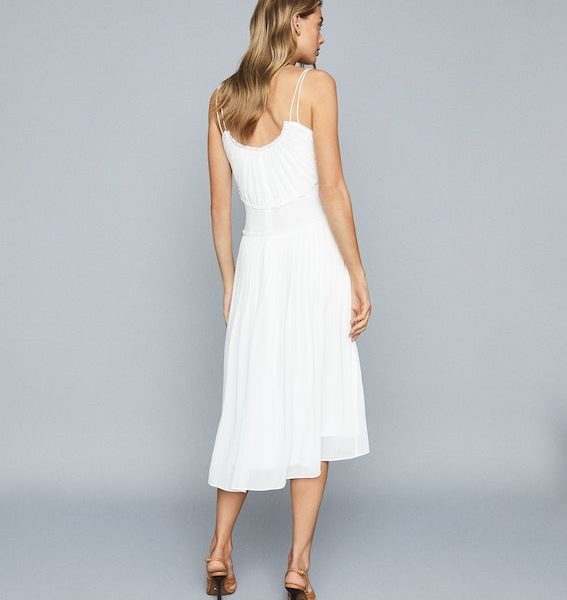 white pleated chiffon dress